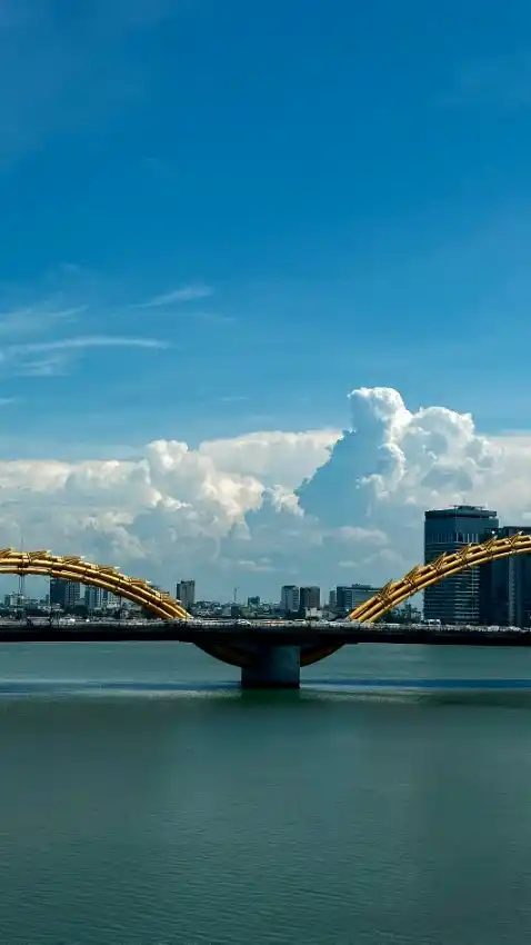 danang cityscape river bridge clouds
