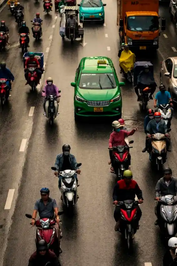 ho chi minh city traffic scooters taxi