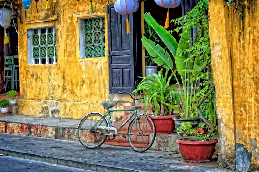 hoi an ancient town yellow wall bicycle