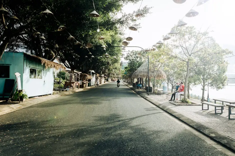 quiet_street_scene_in_kon_tum_vietnam_showcasing_local_architecture_an.webp