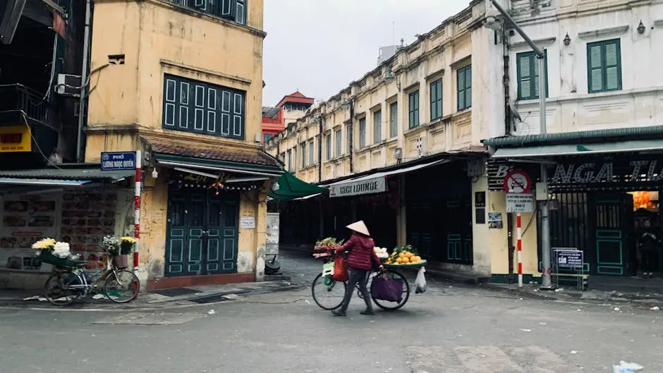 street_vendor_with_a_bicycle_in_the_urban_market_of_hanoi_vietnam.webp
