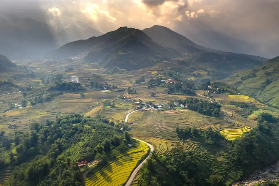Stunning Aerial Shot Of Lush Green Terraced Rice Fields With Mountains