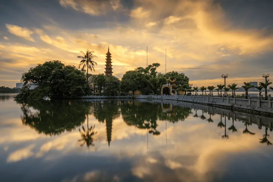Tranquil Sunset At Tran Quoc Pagoda With Sky Reflections On West Lake