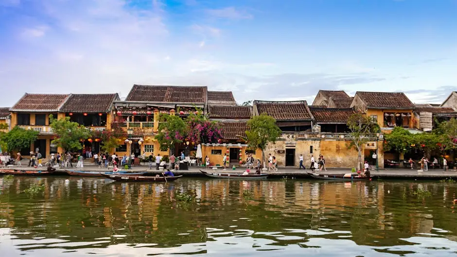 Vibrant Scene Of H I An S Waterfront Showcasing Historical Architectur