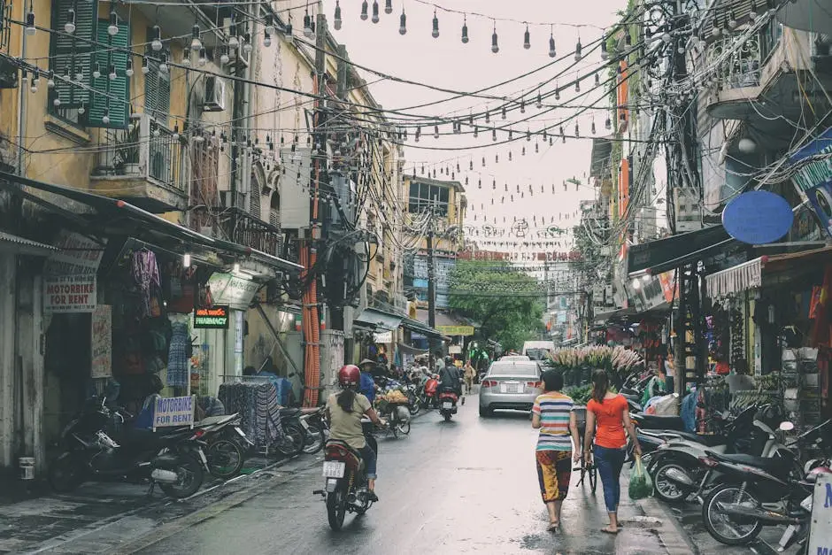 vibrant_street_scene_in_hanoi_s_ng_a_district_with_bustling_markets_an.webp