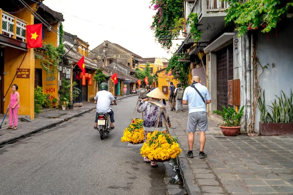 Vibrant Street Scene In Hoi An With Vendor And Motorbike Amidst Histor
